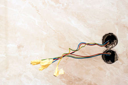 Finishing works at renovated apartment. Electrical wiring installation. Electrical exposed wires...