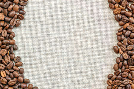 Burlap Sackcloth Canvas and Coffee Beans Placed Round Photo Background. Copy Space. Coffee Borderの写真素材
