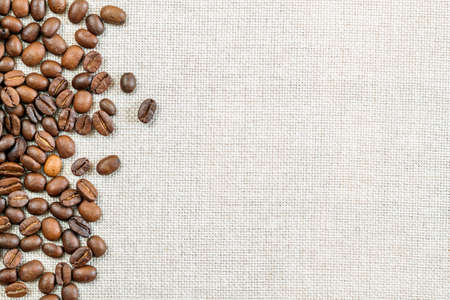 Burlap Sackcloth Canvas and Coffee Beans Photo Background. Copy Space. Coffee Borderの写真素材