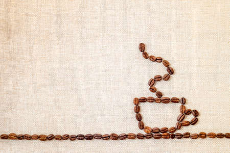 Burlap Sackcloth Canvas and Coffee Beans Photo Background. Copy Space. Coffee Borderの写真素材