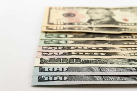 US american dollar money bills spread on white backgroundの写真素材