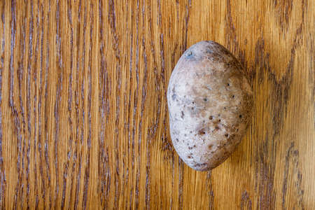 Raw potato food . Potatoes on a wooden table . Free space for text. Top viewの写真素材