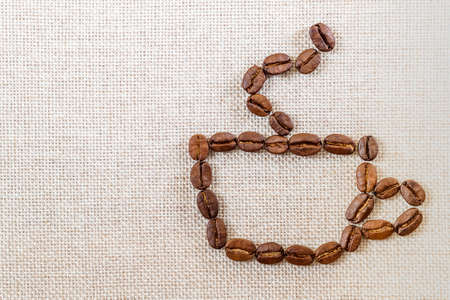 Burlap Sackcloth Canvas and Coffee Beans Photo Background. Copy Space. Coffee Borderの写真素材
