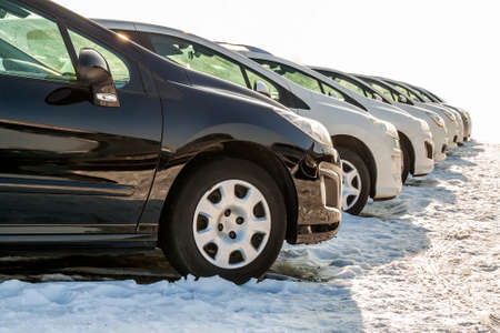 Parked Cars on a Lot. Row of New Cars on the Car Dealer Parking Lot. Cars for Sale Market Theme.