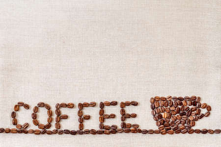 Burlap Sackcloth Canvas and Coffee Beans Photo Background. Copy Space. Coffee Borderの写真素材