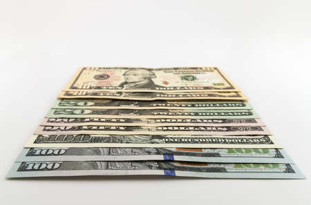 US american dollar money bills spread on white backgroundの写真素材