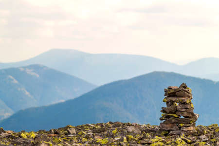 Cairns or rock piles on the top of mountain overlooking  the highlands. Pyramid of stones. Stone...