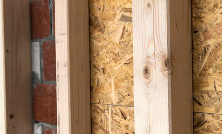 Construction of wood frame walls of a new country house site. Unfinished construction work inside.の写真素材