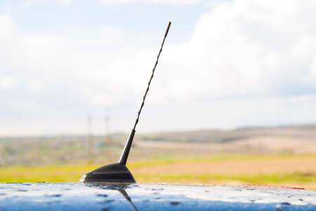 Small radio antenna on the roof of a carの写真素材