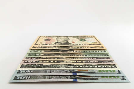US american dollar money bills spread on white backgroundの写真素材