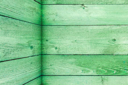 Natural weathered wooden planks background. Old painted in green boards panelsの写真素材