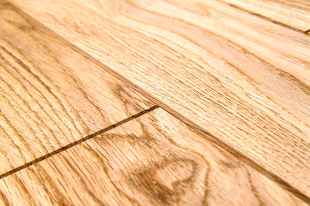 Several planks of beautiful laminate or parquet flooring with wooden texture as backgroundの写真素材