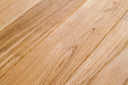 Several planks of beautiful laminate or parquet flooring with wooden texture as backgroundの写真素材