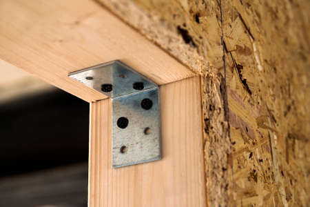 Close up detail of house construction wooden wall elements. Interior frame renovation work