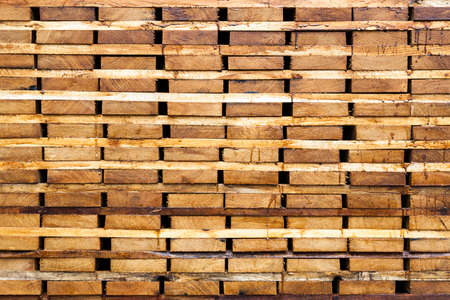 Wood timber construction material background and texture. Stack of lumber,Natural wooden background.の写真素材