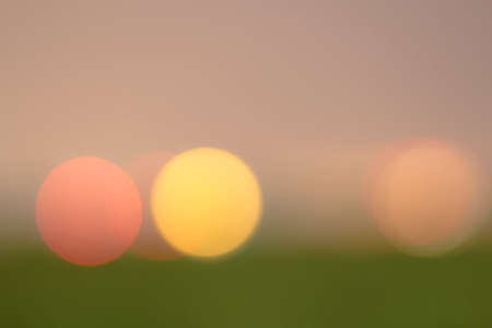 Beautiful green, pink, red and yellow bokeh backgroundの写真素材