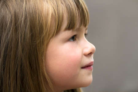 Close-up portrait of pretty little girl. Smiling childの写真素材