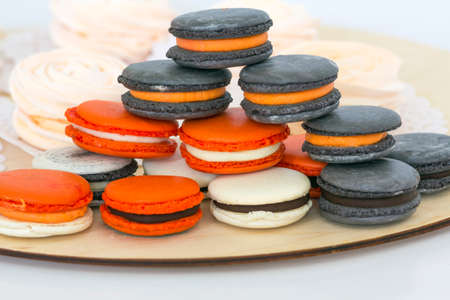 Different kinds of macaroons in stack on light backgroundの写真素材
