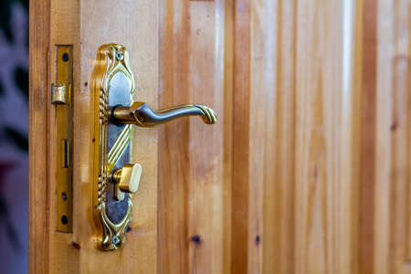 Vintage door handle on wooden doors close-upの写真素材