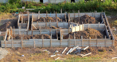 View of construction site and wooden house foundation in preparation process. Cellar construction....