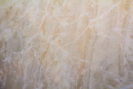 Closeup surface of marble pattern at the marble floor texture background , yellow abstract marble patternの写真素材