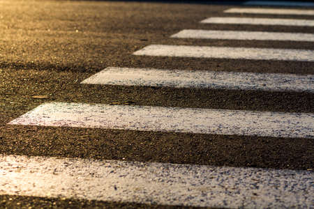 Detail of dangerous road crossing with pedestrian zebra. Safety concept.の写真素材