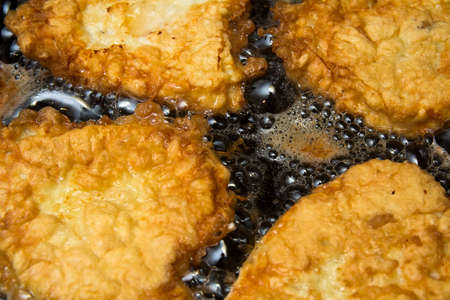 Close-up of meet preparing in frying panの写真素材