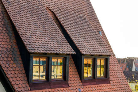 Roof attic windows in old tiled european house