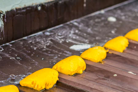Close-up of repair with construction foam on a metal roofの写真素材