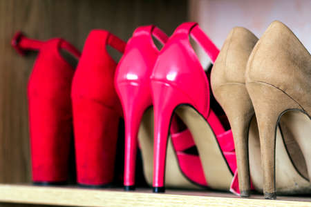 Fashionable high heel women shoes on a shelf