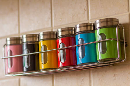 Colorful spice salt and pepper containers in kitchenの写真素材