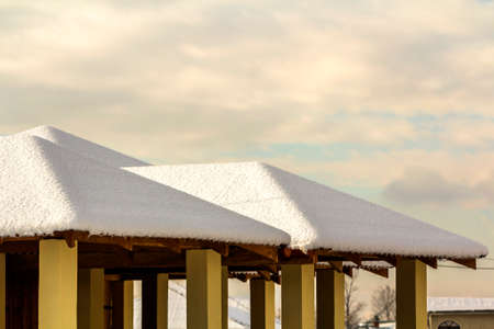 Roof of outdoor alcove covered with snow in winter