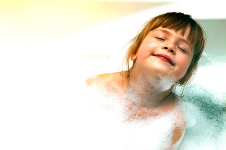 Little girl in bathroom. The symbol of purity and hygiene education.