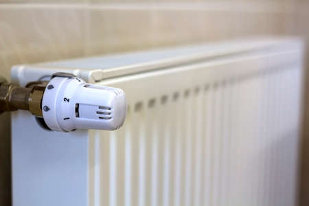 Close-up of valve knob thermostat of heating radiatorの写真素材