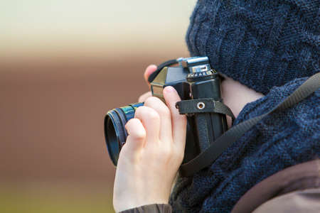 Portrait of little boy with vintage photo camera