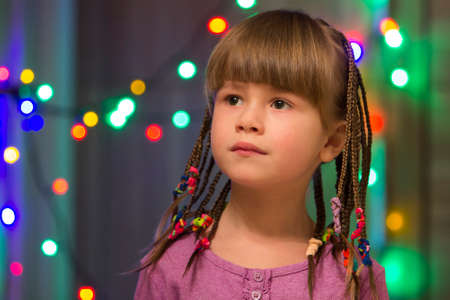 Portrait of pretty little girl with hair braids