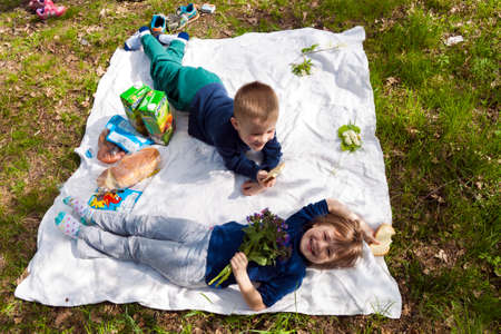 Ivano-Frankivsk, Ukraine - October 12, 2017: Two happy children brother and sister playing and resting in parkのeditorial素材