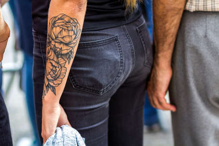 Kyiv, Ukraine - November 14, 2017: Arm of young woman with big tattoo on itのeditorial素材