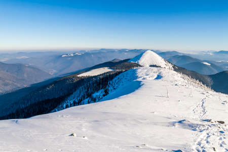 Snow covered winter mountains. Arctic landscape. Colorful outdoor scene, Artistic style post processed photo.の写真素材