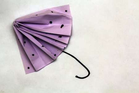 Small purple umbrella made from paperの写真素材