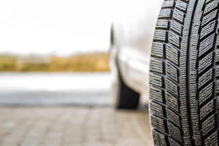 Close-up image of car wheel with black rubber tire