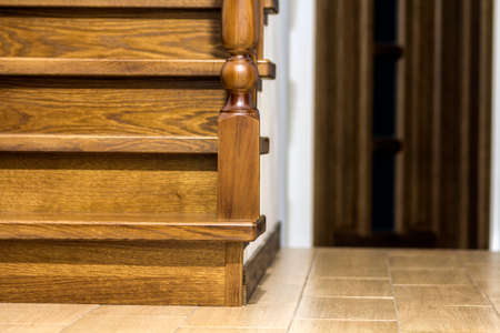 Modern brown oak wooden stairs  and doors in new renovated house interiorの写真素材