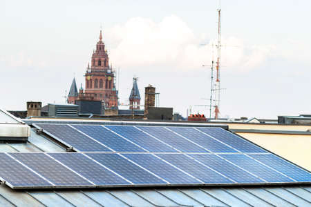Renewable clean green energy saving efficient solar panels on  suburban house roof.