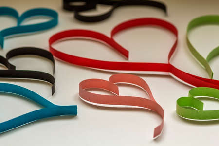 Valentine's day abstract background with cut paper colorful hearts on white.の写真素材