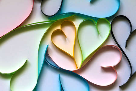 Valentine's day abstract background with cut paper colorful hearts on white.の写真素材