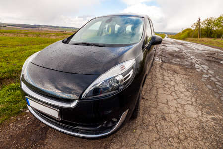 Close-up picture of a modern car on a bad road