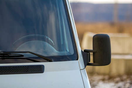 Close up of side rear-view mirror on a modern car.