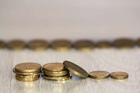Coin stack or money stack and row of coin on wooden table. Financial, Business growth concept. Investment and saving conceptの写真素材