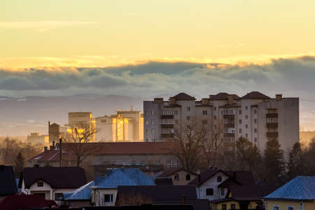Tall apartment building Ivano Frankivsk, Ukraine. Residential architecture with mountains behind.