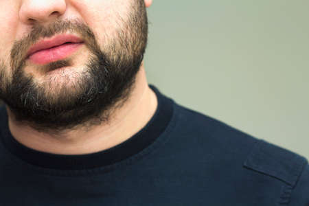 Close-up view of a beard of a handsome young bearded manの写真素材